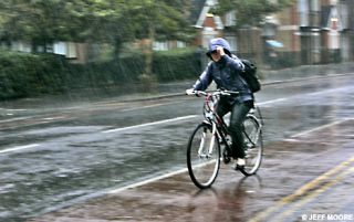 How should you ride on wet pavement?