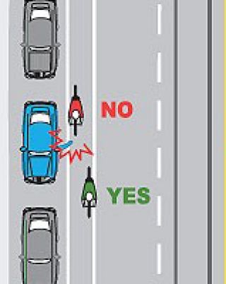 At what distance should you ride away from parked cars?