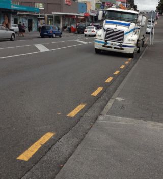 How close can you park to an intersection where there are no broken yellow lines painted on the side of the road?