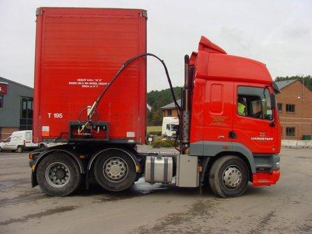 You should not back a tractor under a trailer until the whole air system is: