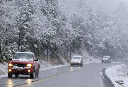 Hydroplaning can occur when you drive through water or slush. If you experience hydroplaning, you should do which of the following?