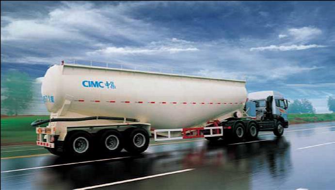 The best way to take a curve with a tanker is to slow to a safe speed before entering the curve, then ______ as you go through it.