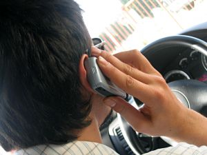 When is it legal to use a cellphone without a hands free device while driving?