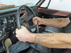 What is the proper way to hold the steering wheel?