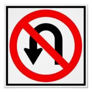 Making U-turns is not legal in which of the following areas?