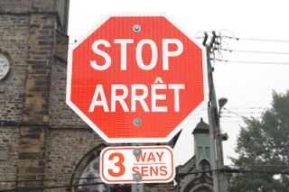 You are approaching a stop sign, you should: