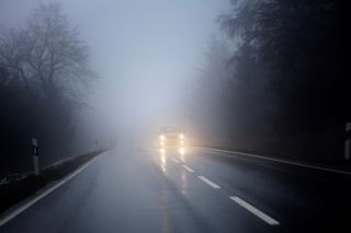 How can you see better when driving in fog?