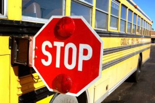 Once you have stopped for a school bus, do not pass until the driver signals you to proceed, the red lights stop flashing, or: