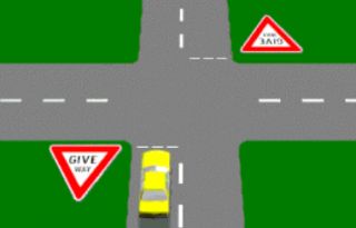 A GIVE WAY sign at an intersection means that you must do which of the following?