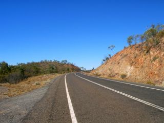 You are approaching a hill or curve. You must not cross the centre line to overtake: