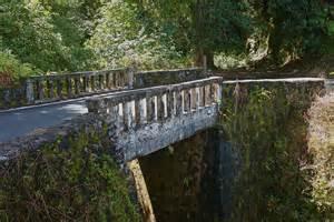 This bridge has only just enough room for two vehicles. As you come close to it you should: