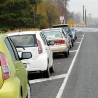 When driving past parked vehicles, which of the following is it most important to do?