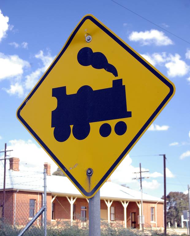 You should not drive across a railway level crossing when: