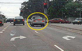 You are turning right from one of two right turn only lanes. How should you use your indicators?