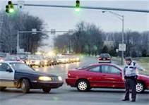 If you have a green light but traffic is blocking the intersection, you should: