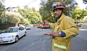A firefighter is directing you to do an illegal turn. What should you do?
