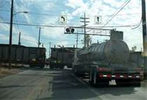 If you are required to stop at railroad crossings, you must: