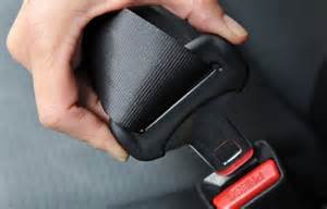 How do seat belts and shoulder straps help a driver <b>control</b> the vehicle?