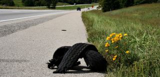 If a tire blows out you should: