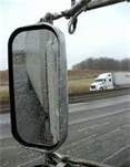 Why should you check your mirrors whenever you apply the brakes hard?