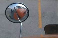 Some large trucks have convex or spot mirrors, which: