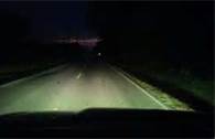 When driving on a clear night, you must dim your headlights from high beams to low beams. You should adjust your speed so you can stop within.
