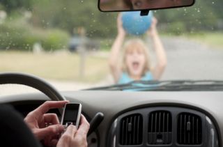 A driver who is a minor receives a phone call on his/her cell phone. He/she should: