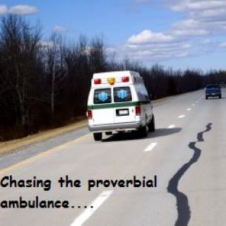 You must not follow within ____ feet of any emergency vehicle with a siren or flashing lights.