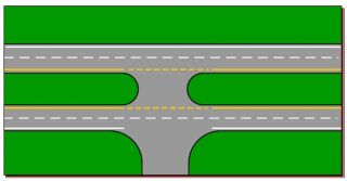 If you are on a single or two-lane road and come to an intersection with a divided highway or a roadway with three or more lanes, you must: