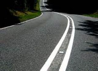 A double solid white line marks the edge of a traffic lane where: