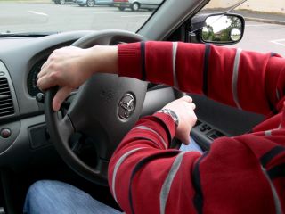 When making a right turn, look right and left, yield right-of-way, and turn the steering wheel using: