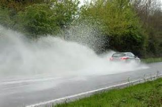 In a standard passenger car, partial hydroplaning can begin at speeds as low as: