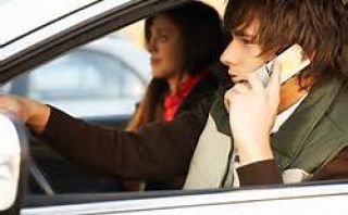 Are minors permitted to talk on cell phones while driving?