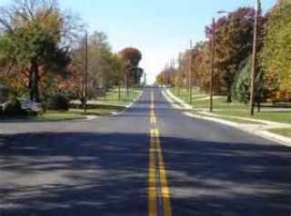 When entering a paved thoroughfare from a private road, a driveway, or an unpaved road, you must