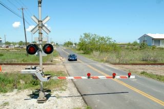 When you approach a railroad crossing, you must stop your vehicle _________ from the nearest rail, if you see an approaching train.