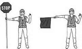 If you are signaled by a flag person at/near a railroad crossing or construction site, you must:
