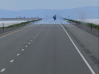 When there is water on the roadway, you must reduce your speed to avoid: