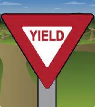 If you see a yield sign in your driving lane, you must: