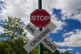 At rail crossings which have the standard, octagonal, red-and-white stop sign, drivers must stop and proceed only when: