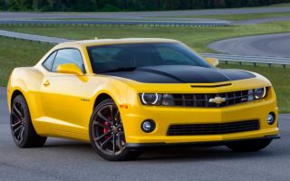 Which Autobot's vehicle form is a 2014 Yellow Chevrolet Camaro concept?