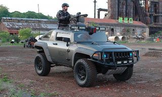 Which Autobot's vehicle form is a Hummer HX Concept in Revenge of the Fallen?