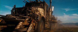 Which Decepticon's vehicle form is an Armored Mad Max Mack semi-trailer truck?