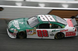 Which Autobot's vehicle form is a Dale Earnhardt, Jr. NASCAR #88 AMP Energy / National Guard?
