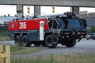 Which Autobot's vehicle form was a Rosenbauer Panther airport crash tender?