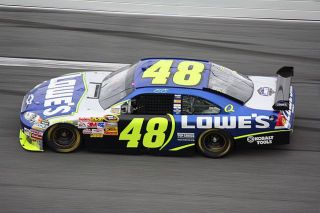Which Autobot's vehicle form is a Jimmie Johnson NASCAR #48 Lowe's / Kobalt?