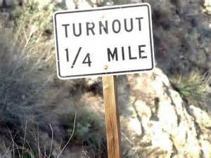 What is the use of the special turnout areas marked on a two lane road?