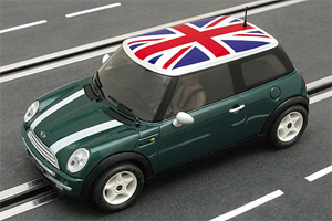 A Mini Cooper says: There is a level crossing ahead!