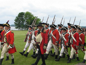 A horde of redcoats shout: March to the carriageway!